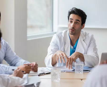 doctor talking passionately in meeting