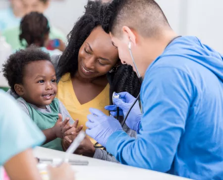 medical professional with mother and little boy