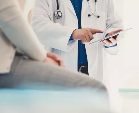 doctor and patient with paperwork