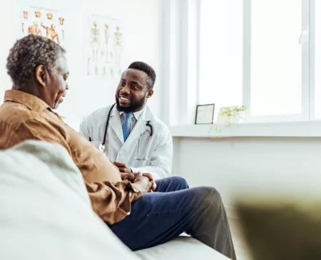 happy doctor with older patient