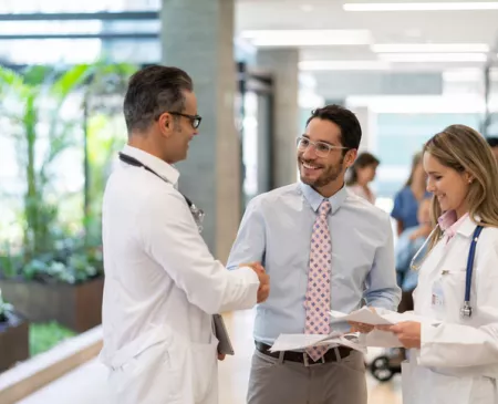 Professionals talking in hallway