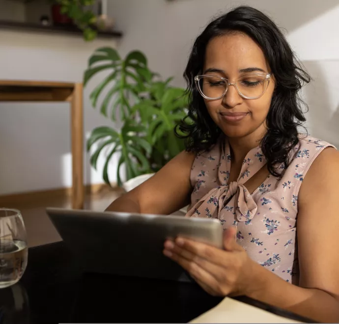 young female looking at tablet