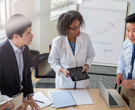 colleagues meeting over data